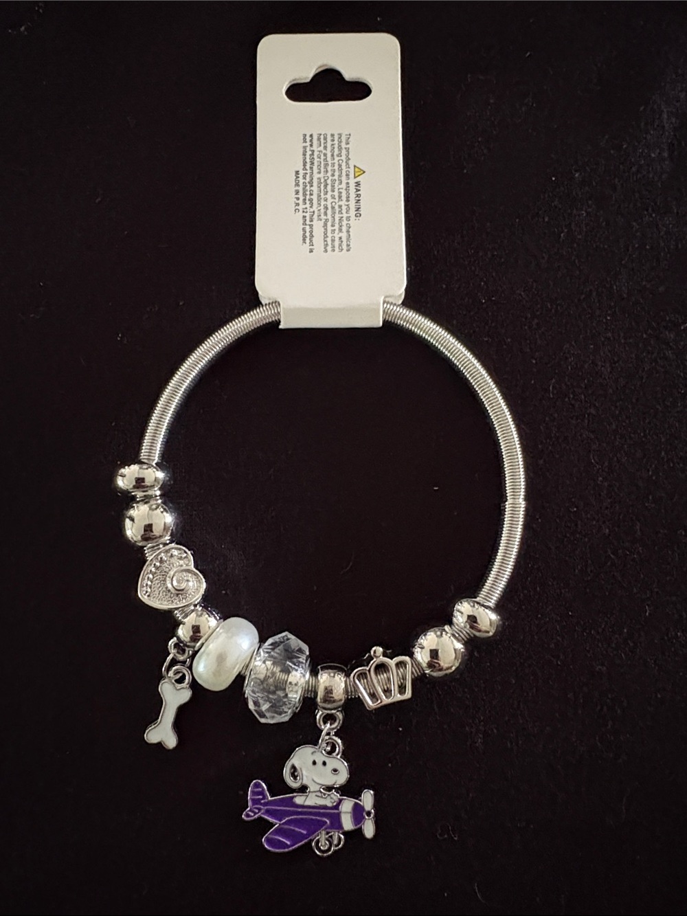 Silver Tone Stretchy Snoopy Charm Bracelet with Purple Airplane